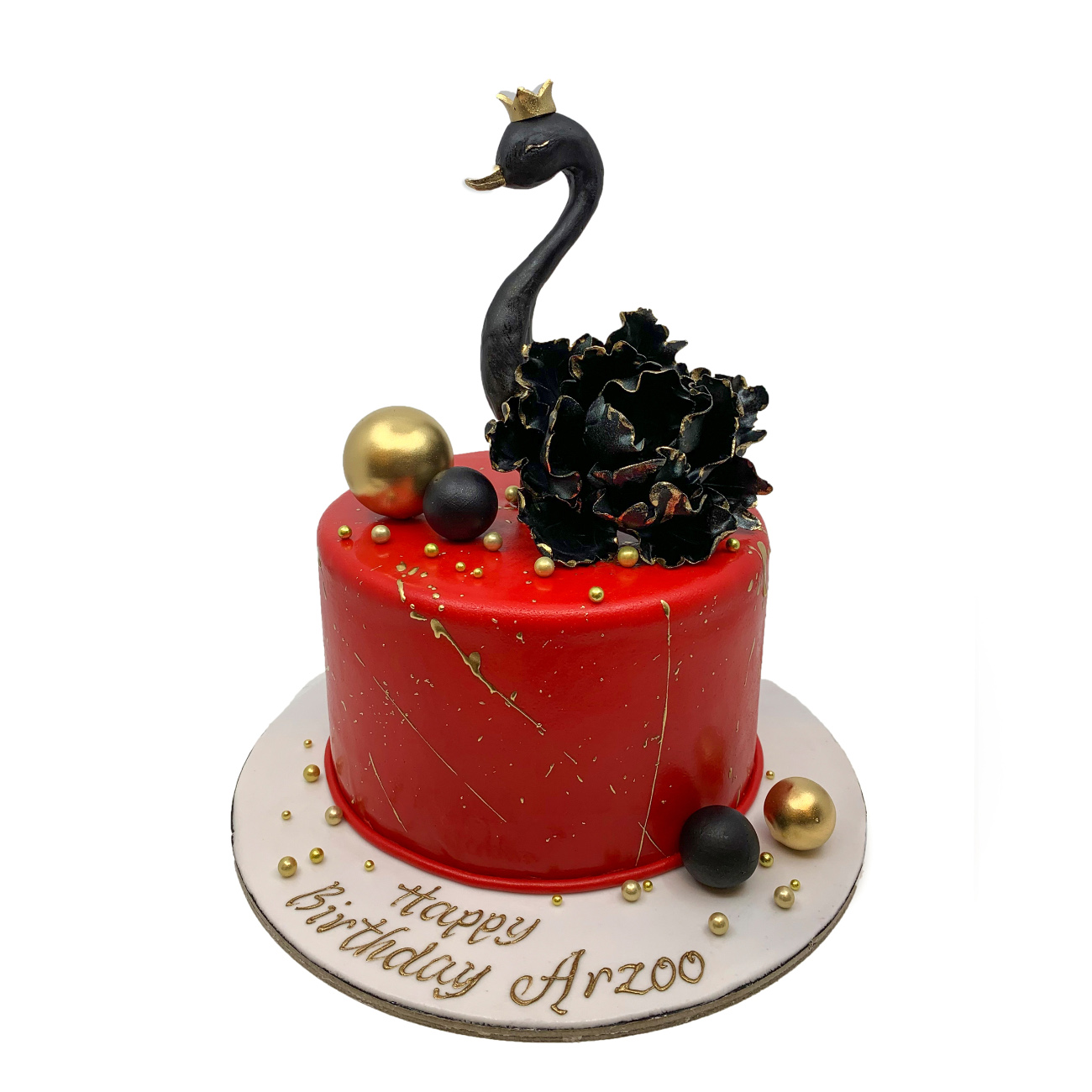 Bold, dramatic, and modern. A rich crimson fondant cake accented with luxury gold splatters, metallic spheres, and a striking black majestic swan centerpiece. Crafted for an unforgettable, sophisticated birthday