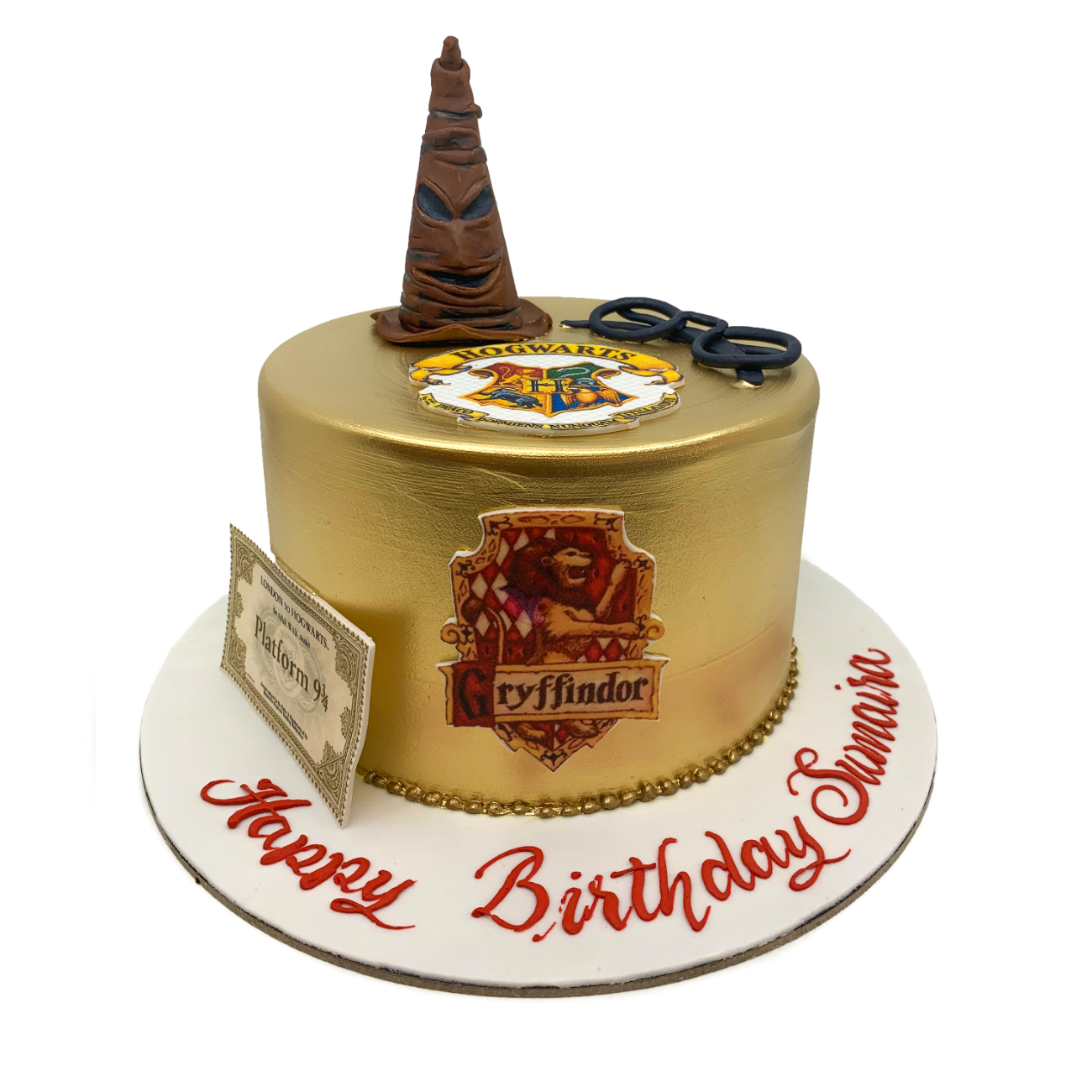 Golden Wizarding World Chronicles Cake